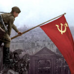 Victory Day celebration- Photo of a Red Army soldier hoisting the Soviet Union's banner atop Reichstag of Berlin after defeating Nazi Germany.